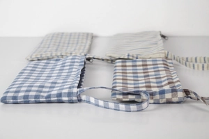 Flat lay of four Japanese style checkered and striped cotton linen pouches with zippers