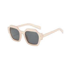 Lunettes de soleil oversize polygonales avec monture champagne translucide et verres gris