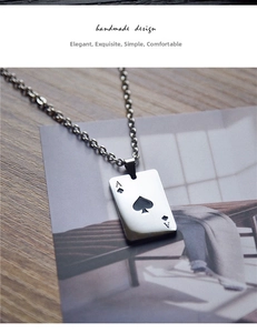 Detail of Ace of Spades card pendant necklace in silver finish with classic cross chain