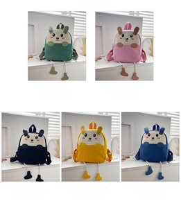 Detail view of five colorful corduroy animal backpacks for toddlers in a grid layout