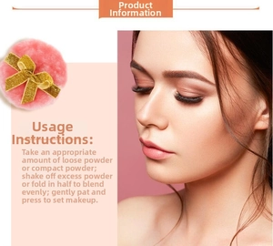 Pink plush powder puff with gold bow detail for face makeup and loose powder application