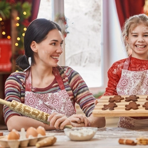 Wooden Christmas rolling pin with reindeer and tree patterns for embossed cookies