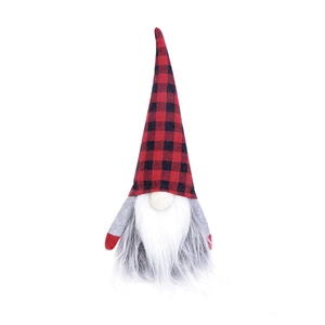 Detail of red and black plaid Christmas gnome with long white beard and knit fabric