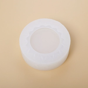 Macro shot of translucent white round silicone mold with internal wave texture