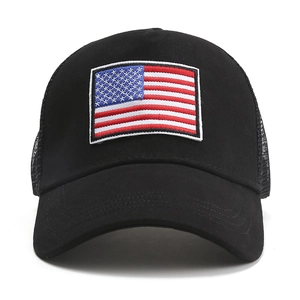 Front view of black trucker hat with American flag embroidery and breathable mesh