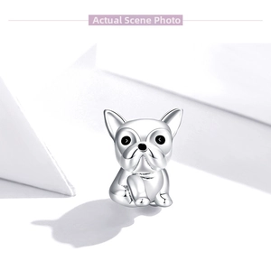 Detailed close-up of a 925 sterling silver French Bulldog charm with black enamel accents