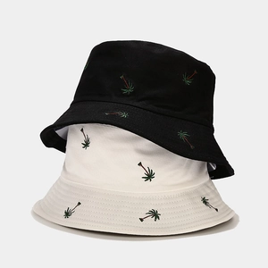 Embroidered coconut tree bucket hats in black and white colors for outdoor sun protection