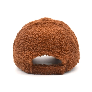 Rear view of a warm brown faux shearling baseball cap with an adjustable strap