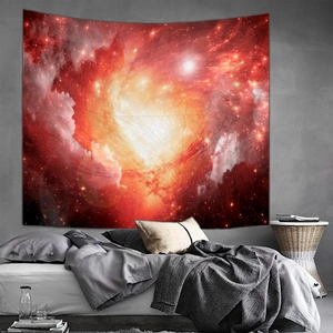 Detail of bedroom wall tapestry featuring a vibrant red and orange starry nebula design