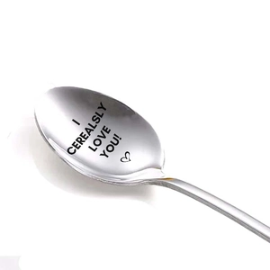 Macro shot of stainless steel spoon with I CEREALSLY LOVE YOU heart engraving