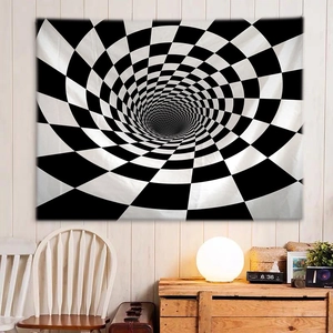 Detail of black and white geometric optical illusion tapestry on a white wooden wall