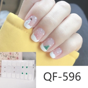 Christmas nail art stickers featuring cute snowman and tree designs on pink base