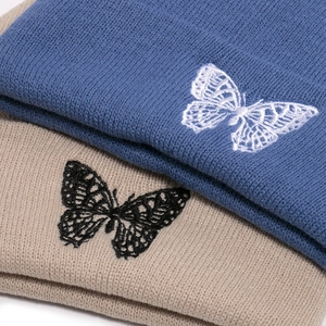 Winter butterfly embroidery knit beanies in blue and beige for warm outdoor wear