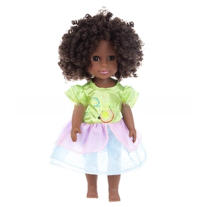 Detail of 14-inch black girl doll featuring thick brown curls and satin mesh dress