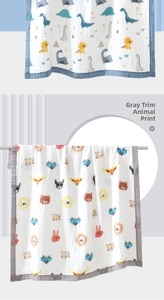 Detail view of double-layer cotton gauze baby swaddle blankets with cute animal patterns