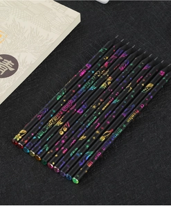 Detail of HB black wood pencils with colorful holographic gold leaf floral patterns