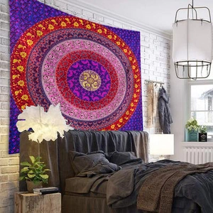 Detailed macro view of purple mandala tapestry hanging on a modern white brick wall