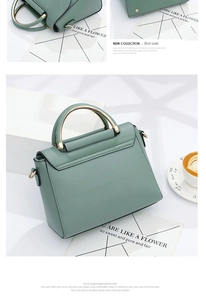 Detail of Morandi green handbag with golden semi-circular handle and smooth leather texture