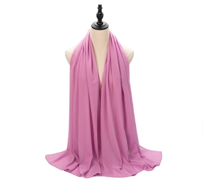 Detail of pink pearl chiffon hijab scarf showing soft texture and elegant drape on mannequin