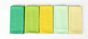 Detail view showing folded pearl chiffon fabric textures in green and yellow shades
