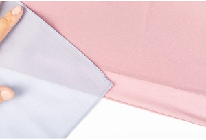 Close-up of pearl chiffon hijab showing lavender and pink fabric texture with fine stitching