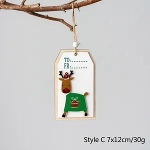 Christmas wooden reindeer gift tag with green sweater design and jute rope hanging on branch