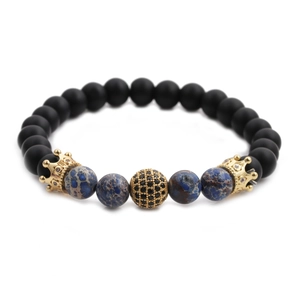 Detailed close-up of 8mm matte black and blue beads with micro-set zircon crown accents