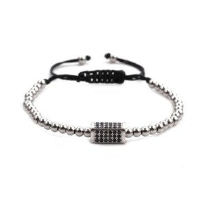 Detail of silver beaded bracelet featuring a pavé black crystal centerpiece and cord