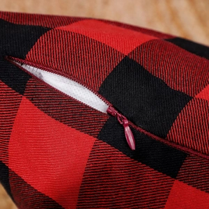 Red and black buffalo plaid Christmas pillow cover with hidden zipper detail and twill fabric
