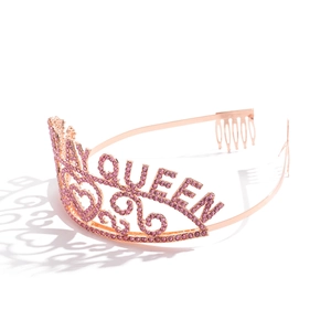 Detail of rose gold tiara with pink rhinestones spelling QUEEN for 30th birthday