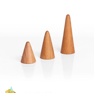 Three conical wooden ring holders in different sizes for jewelry display and storage