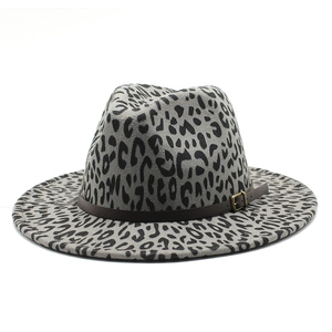 Gray leopard print fedora hat with a wide brim and decorative brown leather belt strap