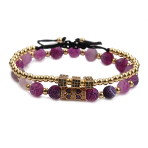 Double-layered beaded bracelet with purple cracked stones and gold cubic zirconia charms