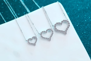 Detailed comparison of three sizes of S925 sterling silver heart necklaces with pavé stones