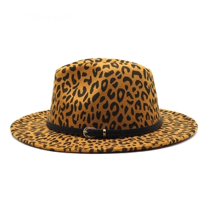 Detail of leopard print wide brim fedora hat featuring black leather band and gold buckle