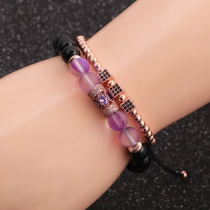 Rose gold moonstone bracelet set with cubic zirconia beads on a model's wrist