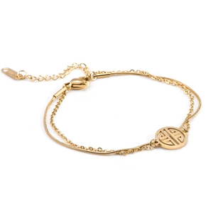 Double-layered gold stainless steel bracelet featuring delicate chains and a circular pendant