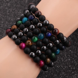 Men's 8mm hematite and tiger eye beaded bracelet set on model's wrist with matte black beads