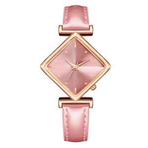 Detailed view of pink rhombic dial watch with rose gold case and leather strap