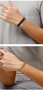 Detailed close-up of Cuban link bracelets in polished black and 18K gold finishes