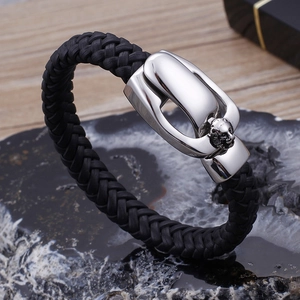 Men's black leather braided bracelet with silver lion head stainless steel clasp on stone