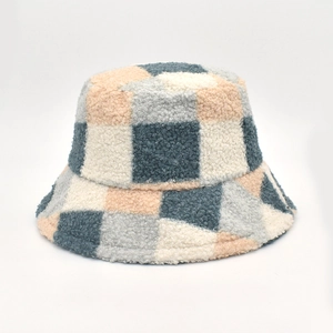 Winter sheepskin-like fleece bucket hat with blue and orange plaid pattern on white background