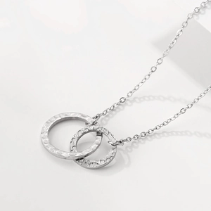 Minimalist stainless steel double interlocking ring necklace with hammered texture finish