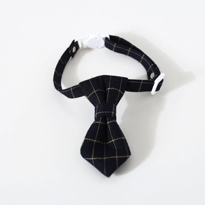 Detail view of navy plaid pet bowtie collar with white adjustable plastic safety buckle