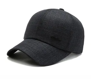Detail view of the side profile on a gray baseball cap with embossed sport lettering