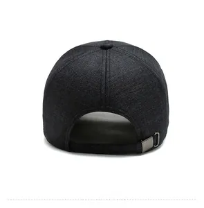 Detail of navy cotton baseball cap showing adjustable silver metal buckle on the back