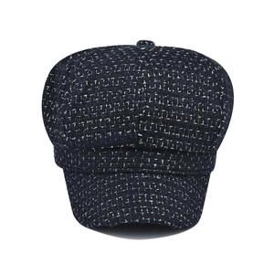 Classic British style tweed newsboy cap in dark blue with vintage texture and top button