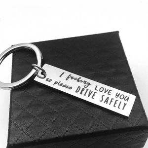Polished stainless steel keychain with I Love You Drive Safely message on leather box