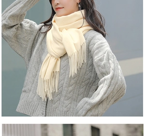 Close-up of soft cashmere-feel tassels on beige and light gray Morandi scarves