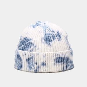 Detailed view of the blue and white tie-dye knit pattern on the beanie hat texture